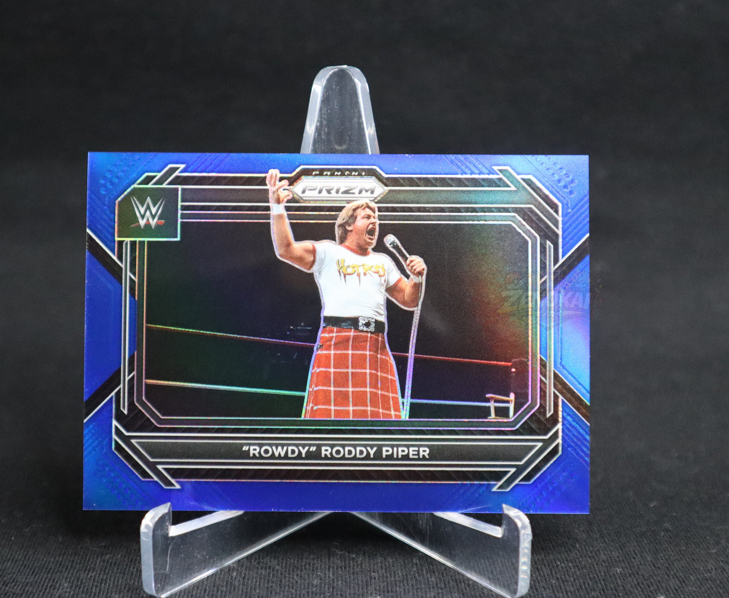 Rowdy Roddy Piper - 2023 Panini Prizm WWE Blue Prizm /199 #19